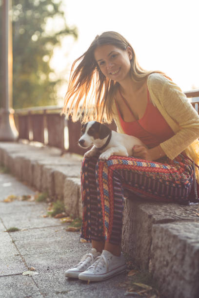 istock Young woman and her little dog 842878332