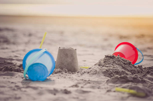 istock Buckets and shovels on beach in summer 842878588
