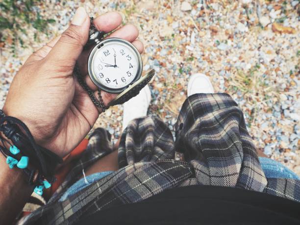 Vintage watch pocket on hand with sneakers