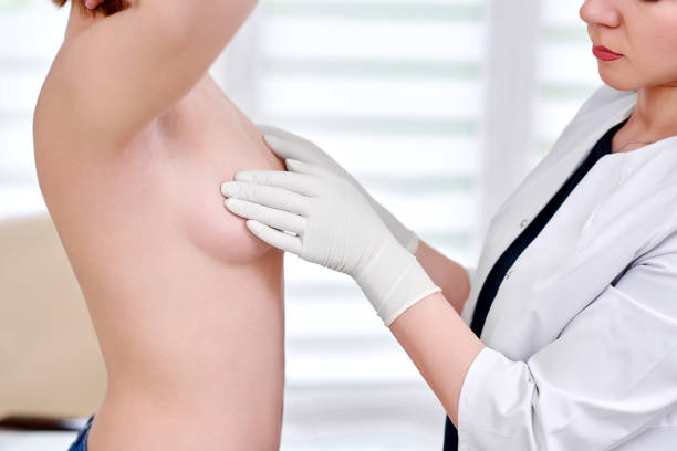 Young woman getting breast examination at the hospital stock photo