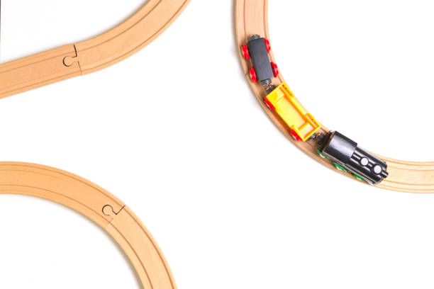 istock Toy train and wooden rails on white background. Top view. Copy space for text 842886286