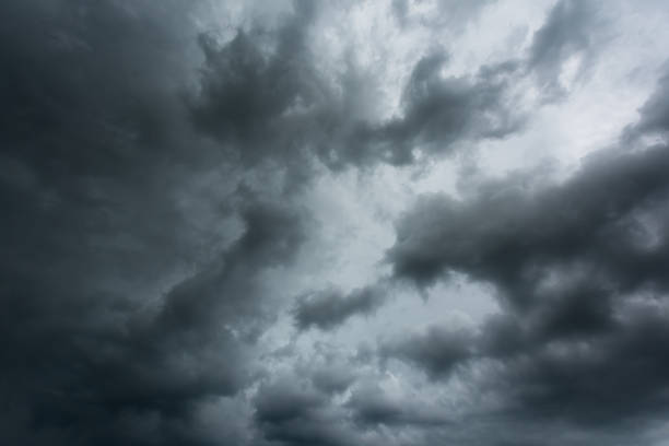 istock Dark sky and black clouds before rainy, Dramatic black cloud and thunderstorm 842894710