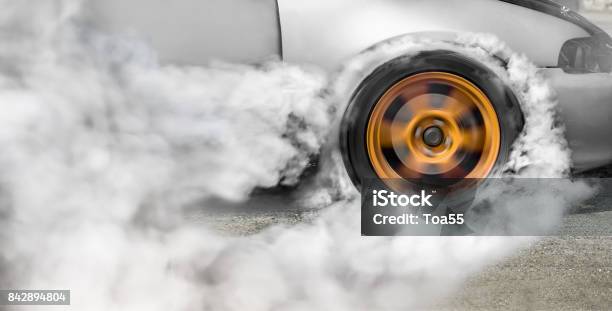 Drag Racing Car Burns Rubber Off Its Tires In Preparation For The Race Stock Photo - Download Image Now