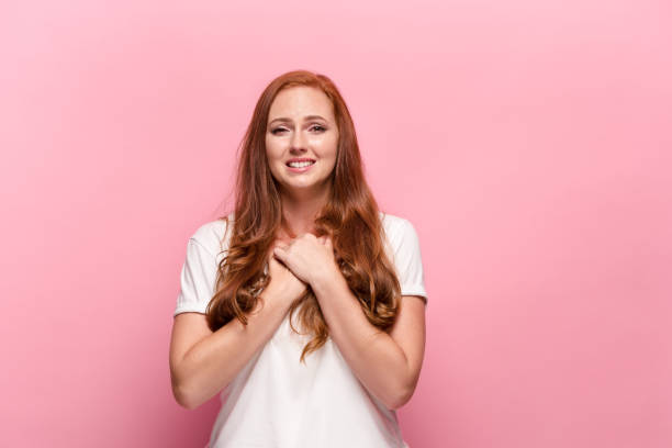 istock The beautiful woman is offended on pink studio 842898584