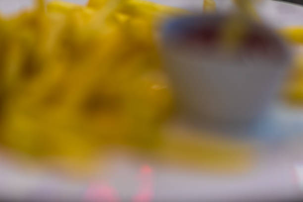 Abstract blurred french fries for background usage.