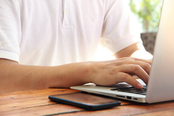 istock Male hand typing with laptop 842902478