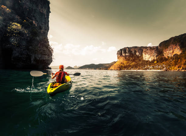 istock Woman paddles kayak 842904062