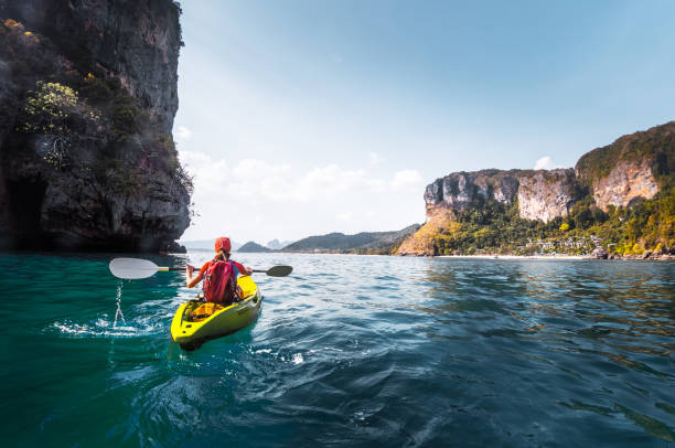 istock Woman paddles kayak 842904134