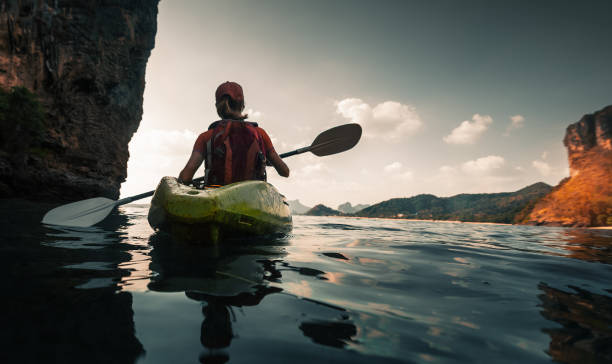 istock Woman paddles kayak 842906216
