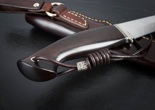 istock hunting knife handmade on a black background. Leather Sheath Handmade 842915820