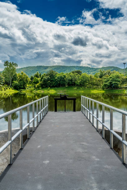 istock Mountain trees and green lake 842919090