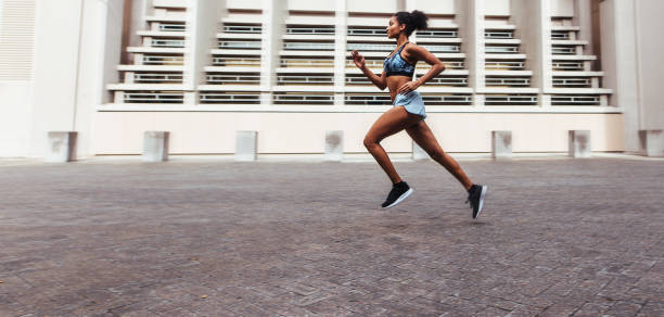 istock Woman running outdoors 842919096
