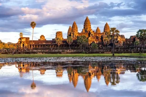 Beautiful moment with reflection of Angkor Wat on the lake surface during the sunset period in Siem reap, Cambodia