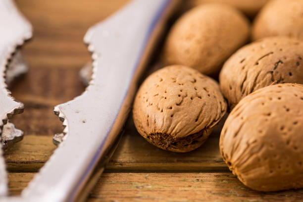 istock Group of almonds nuts in a wooden table 842920140