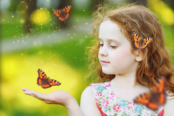 istock Surprised curly girl with a butterfly on his finger. 842920844