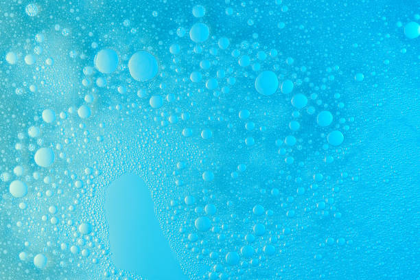 Abstract soap foam bubbles Abstract soap foam bubbles on blue flat background. Washing liquid surface soap sud foam bubble laundry stock pictures, royalty-free photos & images