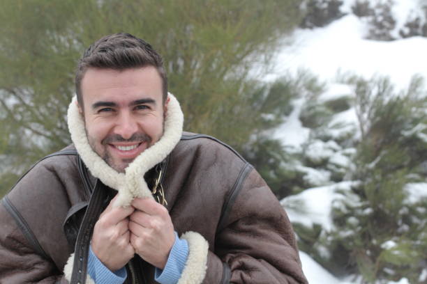 istock Handsome man smiling in the winter 842929118