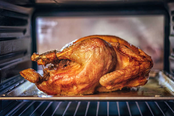 istock Turkey Roasting in the Oven 842932574