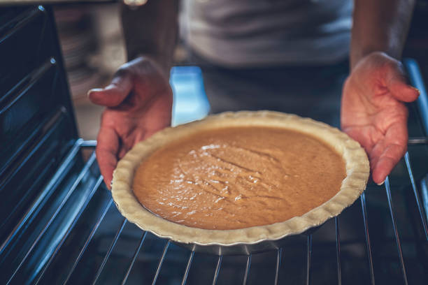 istock Baking Pumpkin Pie for the Holidays in the Oven 842932588