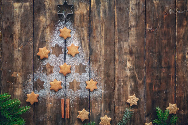 istock Christmas Tree with Star Cookies on Rustic Background 842933344