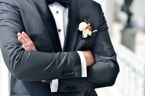 istock Handsome groom in suit in the nature 842936170