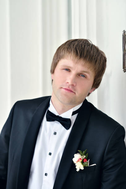 istock Handsome groom in suit in the nature 842936956