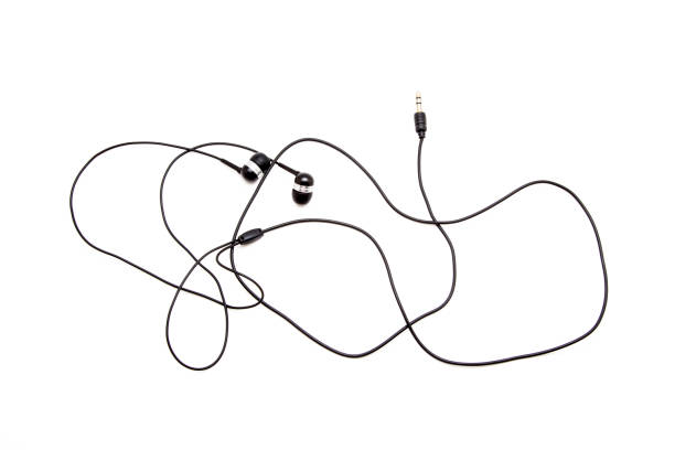 istock In-ear headphones on a white background 842938052