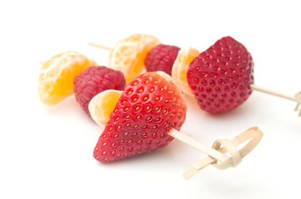istock duo of fruits skewer presentation on white background 842940930