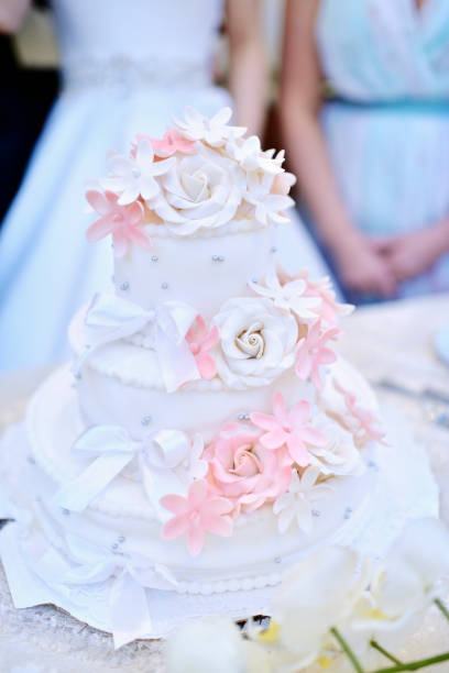 istock Beautiful wedding cake for bride and groom indoors 842945280