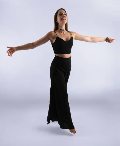 istock Happy woman dancing and floating on air. 842945308