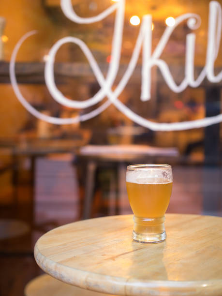 glass of beer on wooden table