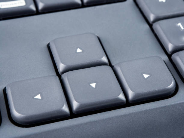 istock Gray keyboard with focus on arrow keys and soft focus on back 842948608