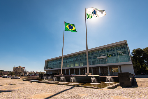 Government Building of Curitiba With Brazilian Flag Against the Sun.