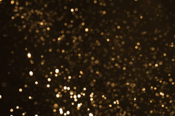 istock abstract glitter bokeh beautiful background in gold. 842950104