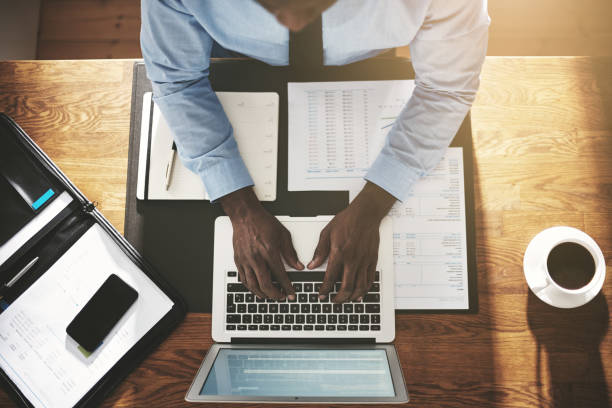 istock Executive busy working on a laptop at his desk 842950294