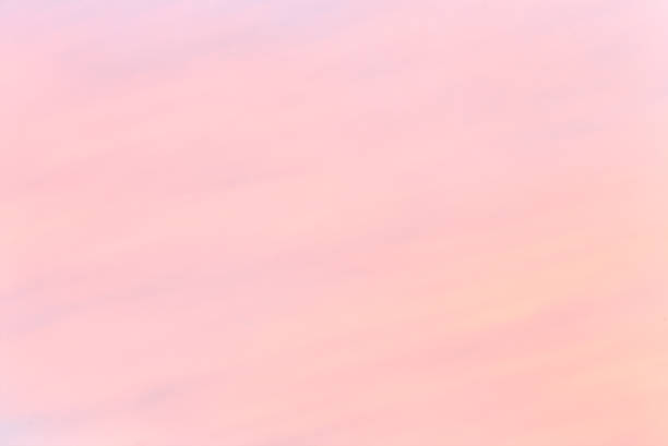 Tender colorful gradient of the sky at the cloudless sunrise early in the morning stock photo