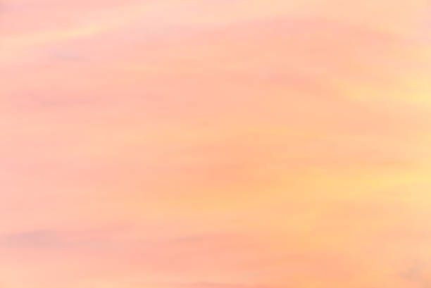 Tender colorful gradient of the sky at the cloudless sunrise early in the morning stock photo