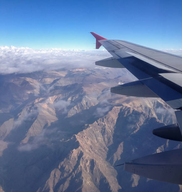 istock Airplane wing flying over the Andes 842961472