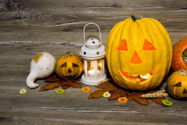 istock Halloween pumpkin head jack lantern on wooden background 842961572