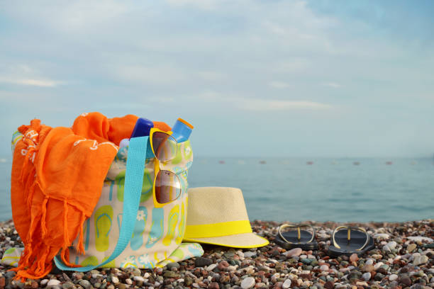 istock Straw hat, bag, sunglasses and flip flops 842964514