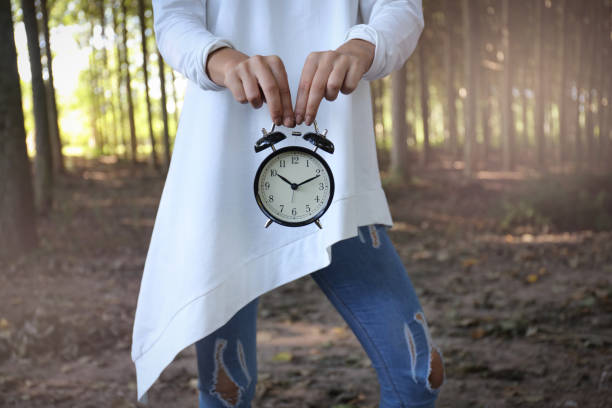 istock Woman with alarm clock 842965812