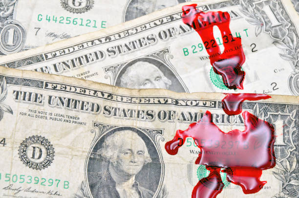 Dollar bill and blood stock photo
