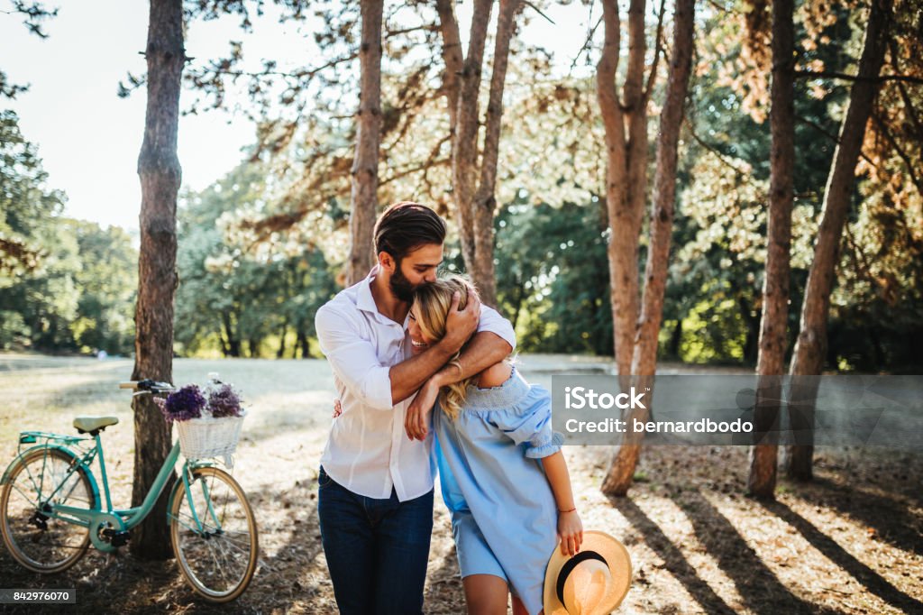 Some moments last a lifetime Photo of a young couple embracing in the nature. Couple - Relationship Stock Photo