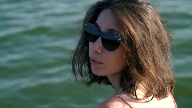 Fashion Woman In Sunglasses With Beach Reflection