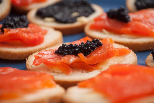 closeup of Lump fish roe and  salmon appetizers in a plate