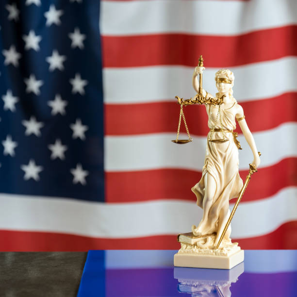 istock Law symbols on USA flag background. 842988594