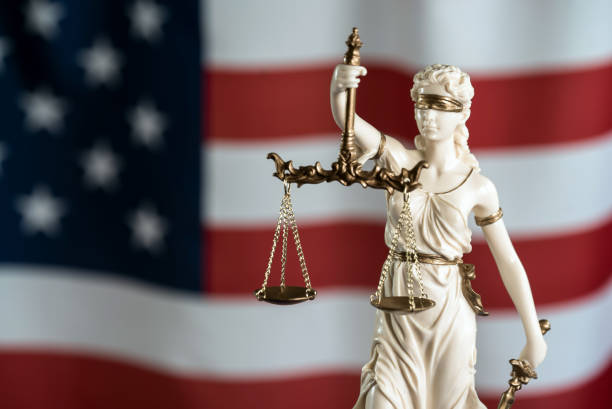 istock Law symbols on USA flag background. 842988598