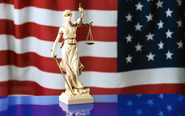 istock Law symbols on USA flag background. 842988600