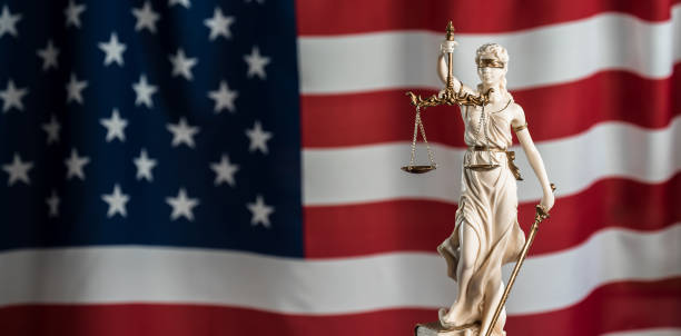 istock Law symbols on USA flag background. 842988602