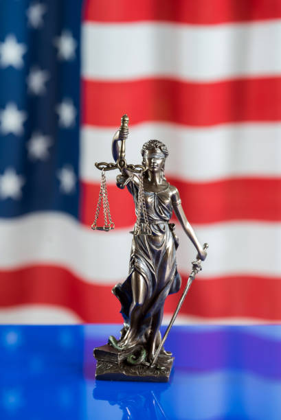istock Law symbols on USA flag background. 842988726